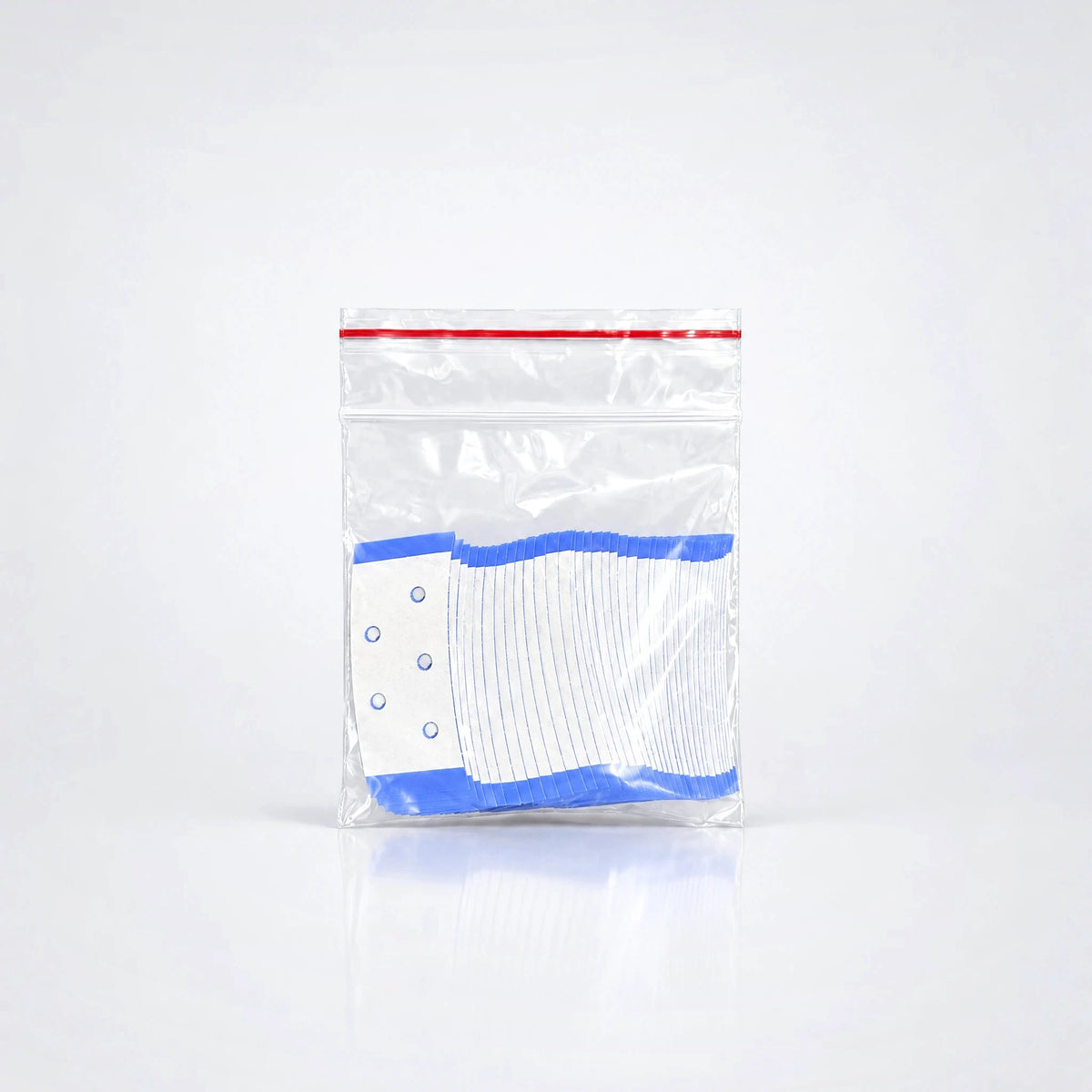 Extenda-Bond Plus – Ventilerad Tejp för Peruk & Toupé – Tape Strips i påse